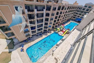 an aerial view of an apartment complex with two swimming pools at فندق جوليانا بيتش in Hurghada