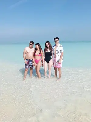 a group of people standing in the water on the beach at Speed Boat Tour Hurghada 4 Hours in Hurghada