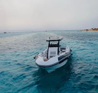 a small boat in the middle of the water at Speed Boat Tour Hurghada 4 Hours in Hurghada