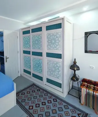 a room with blue and white tile on the wall at Holiday Seaview Home I Near Palacio Hotel I WIFI in Hurghada
