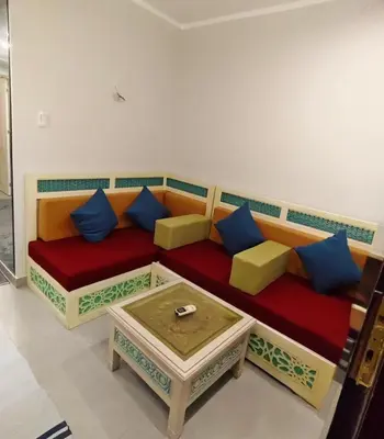 a living room with a couch and a coffee table at Holiday Seaview Home I Near Palacio Hotel I WIFI in Hurghada