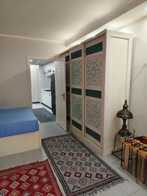 a small room with a bed and a kitchen at Holiday Seaview Home I Near Palacio Hotel I WIFI in Hurghada