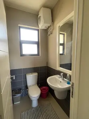 a small bathroom with a toilet and a sink at Lovely 1 bd apartment with amazing view in Tawila in Hurghada