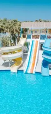 a water slide in a resort with blue water at Apartment for daily rent free beach access in Hurghada