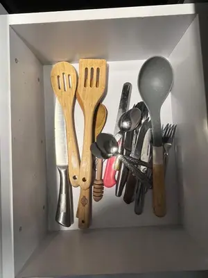 a drawer filled with spatulas and other kitchen utensils at Benashti Hurghada apartment in Hurghada