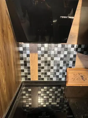 a bathroom with a checkered floor and a counter at Benashti Hurghada apartment in Hurghada