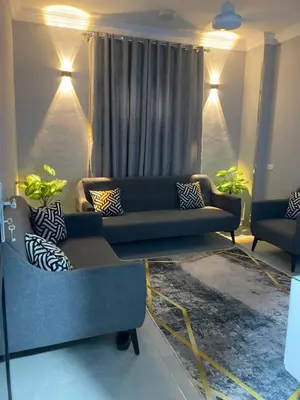 a living room with a couch and two chairs at سمسم in Quseir