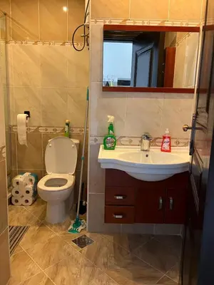 a bathroom with a toilet and a sink and a mirror at Appartement hurghada gravity beach in Hurghada