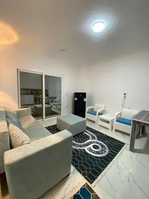 a living room with a couch and a table at الكوثر in Hurghada