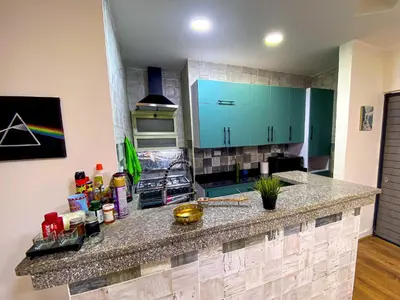 a kitchen with blue cabinets and a counter top at Bright 2BR & Office, Remote Work Ready & Long Stays in Hurghada