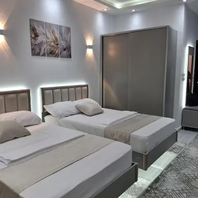 two beds in a room with two beds sidx sidx sidx sidx at Luxury Apartment Pool&Private Beach in Hurghada