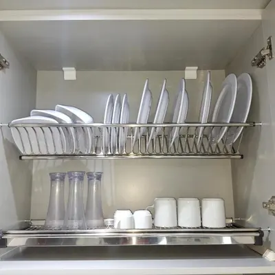a kitchen with plates and utensils in a refrigerator at Luxury Apartment Pool&Private Beach in Hurghada