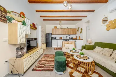a living room with a couch and a table at Exclusive Heated Pool Chalet for a Luxury in Hurghada