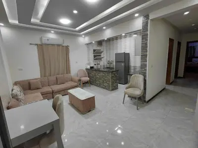a living room with a couch and a table at شقق للايحار وشقق للبيع داخل الغردقه in Hurghada