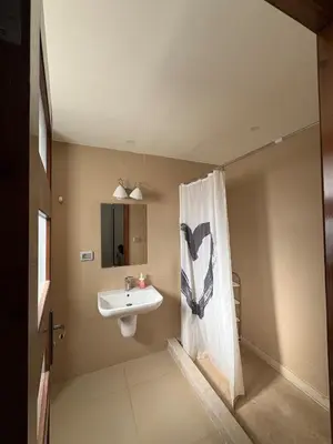 a bathroom with a sink and a shower curtain at Luxury 2 BR Villa with garden - Baywest - somabay in Hurghada