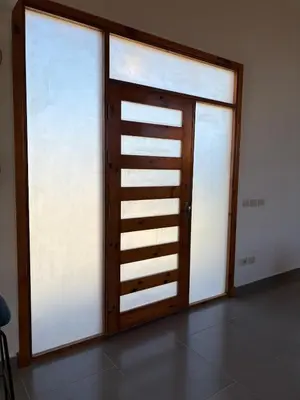 a room with two sliding glass doors in a room at Luxury 2 BR Villa with garden - Baywest - somabay in Hurghada