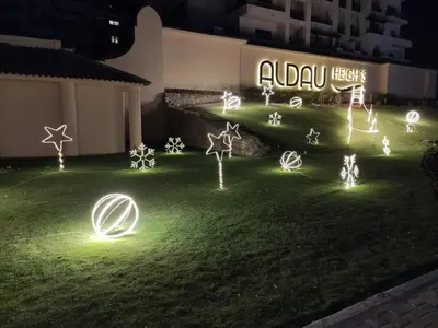 a group of lights in the grass at night at Mark one bedroom sea view in Hurghada