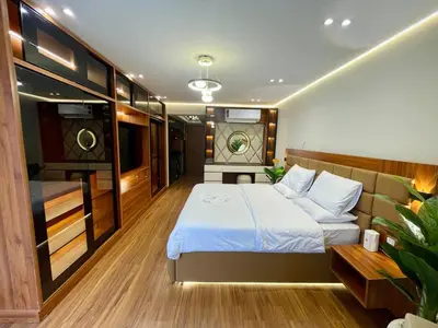a bedroom with a bed and a tv on a boat at Luxury Studio in Hurgada Egypt in Hurghada