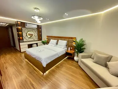 a bedroom with a bed and a couch at Luxury Studio in Hurgada Egypt in Hurghada