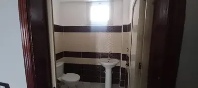 a small bathroom with a sink and a toilet at Apartment with Balcony in Luxor