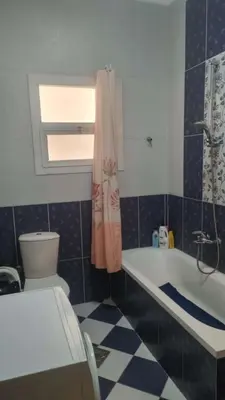 a bathroom with a toilet and a bath tub at Barbara Hurghada in Hurghada