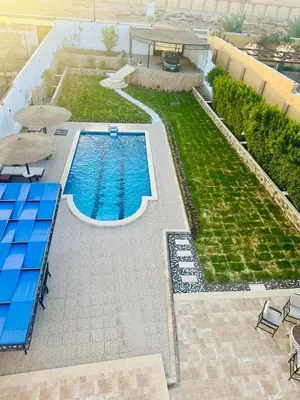 an overhead view of a swimming pool in a yard at villa sky in Hurghada