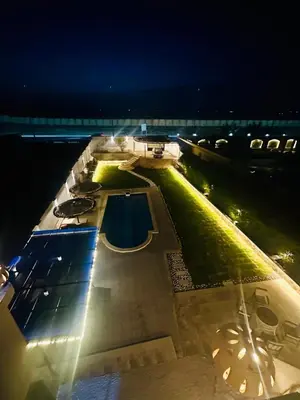 an overhead view of a swimming pool at night at villa sky in Hurghada