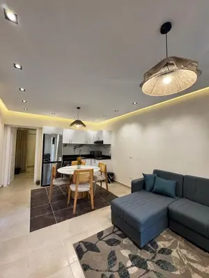 a living room with a couch and a table at Karma in Hurghada