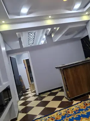 a room with a ceiling and a checkered floor at الاقصرالكرنك بجوار معبد الكرنك in Luxor