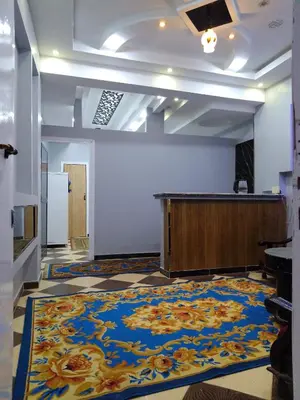 a large room with a large rug on the floor at الاقصرالكرنك بجوار معبد الكرنك in Luxor