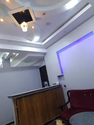 a room with a stage and a podium and a screen at الاقصرالكرنك بجوار معبد الكرنك in Luxor