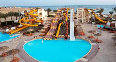 a resort with a water park with a water slide at شاليه فندقى in Hurghada