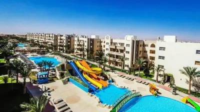 a resort with a water slide and a pool at شاليه فندقى in Hurghada