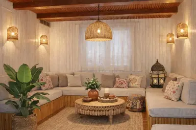 a living room with a couch and a table at Amber Dahabiya in Luxor
