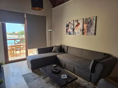 a living room with a couch and a table at Blue haven el gouna in Hurghada