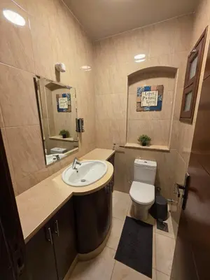 a bathroom with a sink and a toilet at Blue haven el gouna in Hurghada