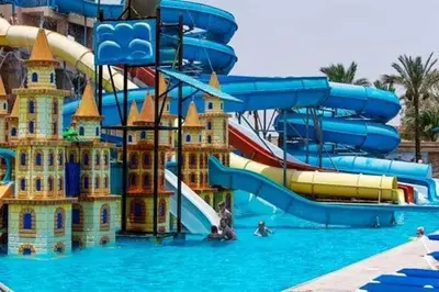 a water park with a water slide and slides at Mirage Bay Resort Hurghada A-775 in Hurghada