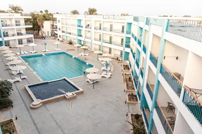 an overhead view of the pool at a hotel at Mirage Bay Resort Hurghada A-775 in Hurghada