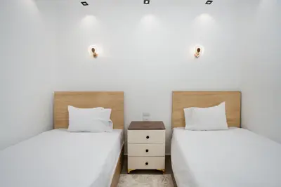two beds sitting next to each other in a bedroom at Luxor Nile View Apartment Marah 1 in Luxor