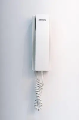 a telephone hanging on a wall with a cord at Luxor Nile View Apartment Marah 1 in Luxor