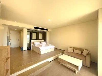 a large bedroom with a bed and a couch at Pool front Mesca Cabana Minutes to Sandy Beach in Soma bay in Hurghada