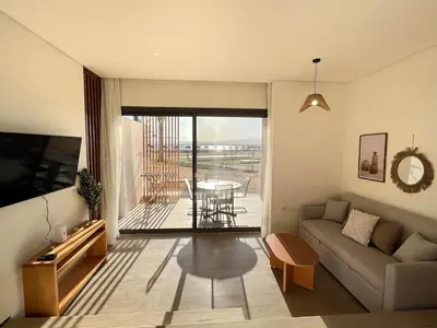 a living room with a couch and a table at Beachfront Cabana Steps to Sandy Beach And Pool in Soma bay in Hurghada