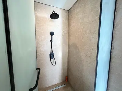 a shower in the corner of a room at Beachfront Cabana Steps to Sandy Beach And Pool in Soma bay in Hurghada