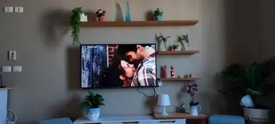 a flat screen tv hanging on a wall at 1 br stylish flat in phase 2 MH in Hurghada