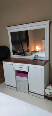 a white vanity with a mirror in a room at 1 br stylish flat in phase 2 MH in Hurghada