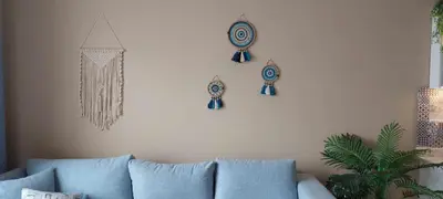 a living room with a couch and some decorations on a wall at 1 br stylish flat in phase 2 MH in Hurghada
