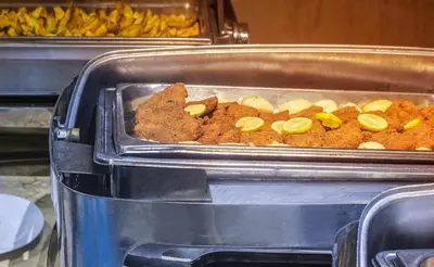 two trays filled with food in a buffet at Pyramisa Island Hotel Aswan in Aswan