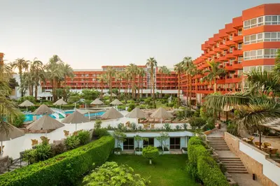 an aerial view of a hotel with a resort at Pyramisa Hotel Luxor in Luxor