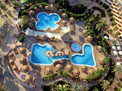 an overhead view of a resort with two pools at Flamenco Beach & Resort Quseir in Quseir