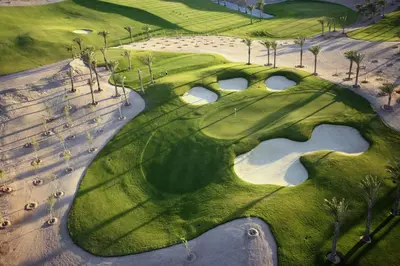 an overhead view of a golf course with a hole at Iberotel Makadi Beach in Hurghada